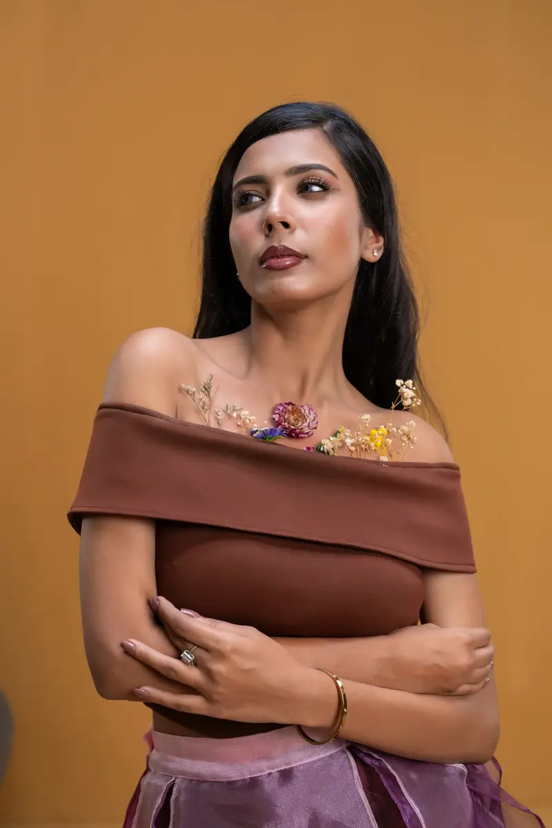 Petal Remains BUFT Graduation Couture Collection 2026 by Bangladeshi fashion designer Narin Juhi — layered organza in dusty rose, violet, cocoa and ivory with ruffles and dried-flower embroidery, photo 2 of 36