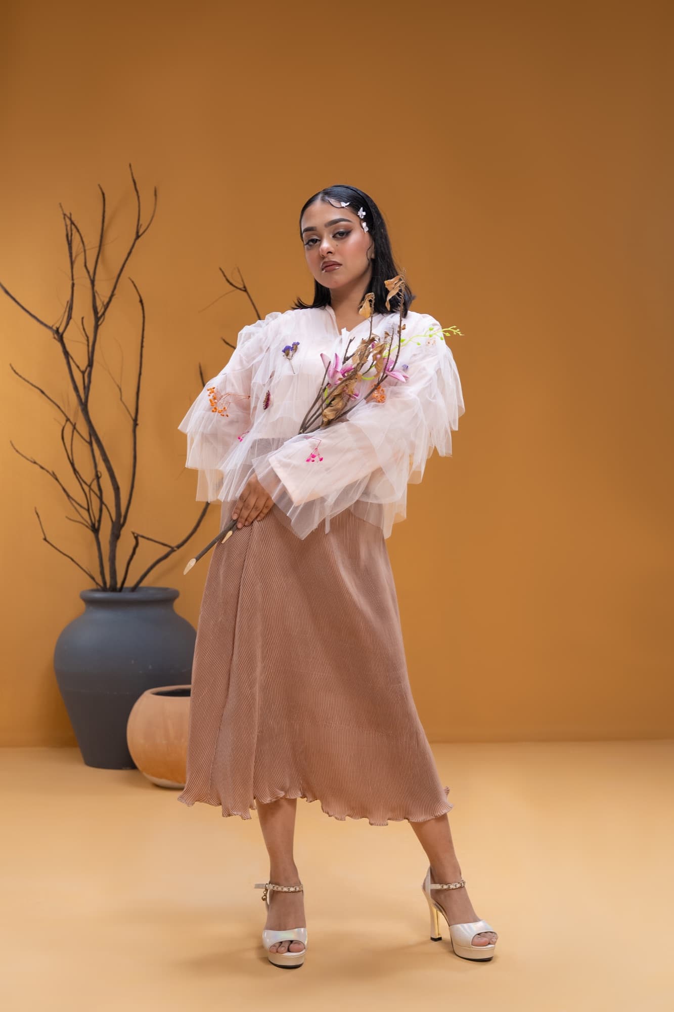 Petal Remains BUFT Graduation Couture Collection 2026 by Bangladeshi fashion designer Narin Juhi — layered organza in dusty rose, violet, cocoa and ivory with ruffles and dried-flower embroidery, photo 31 of 36