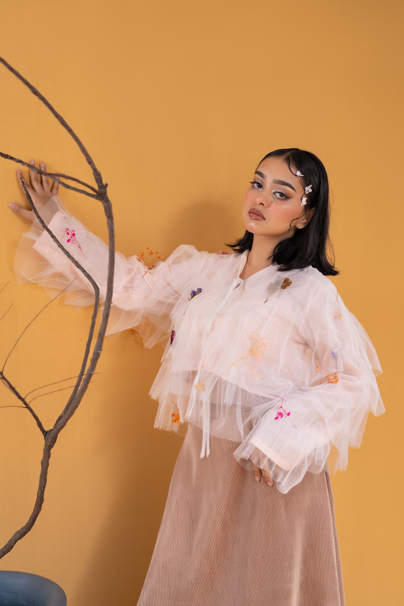 Petal Remains BUFT Graduation Couture Collection 2026 by Bangladeshi fashion designer Narin Juhi — layered organza in dusty rose, violet, cocoa and ivory with ruffles and dried-flower embroidery, photo 32 of 36