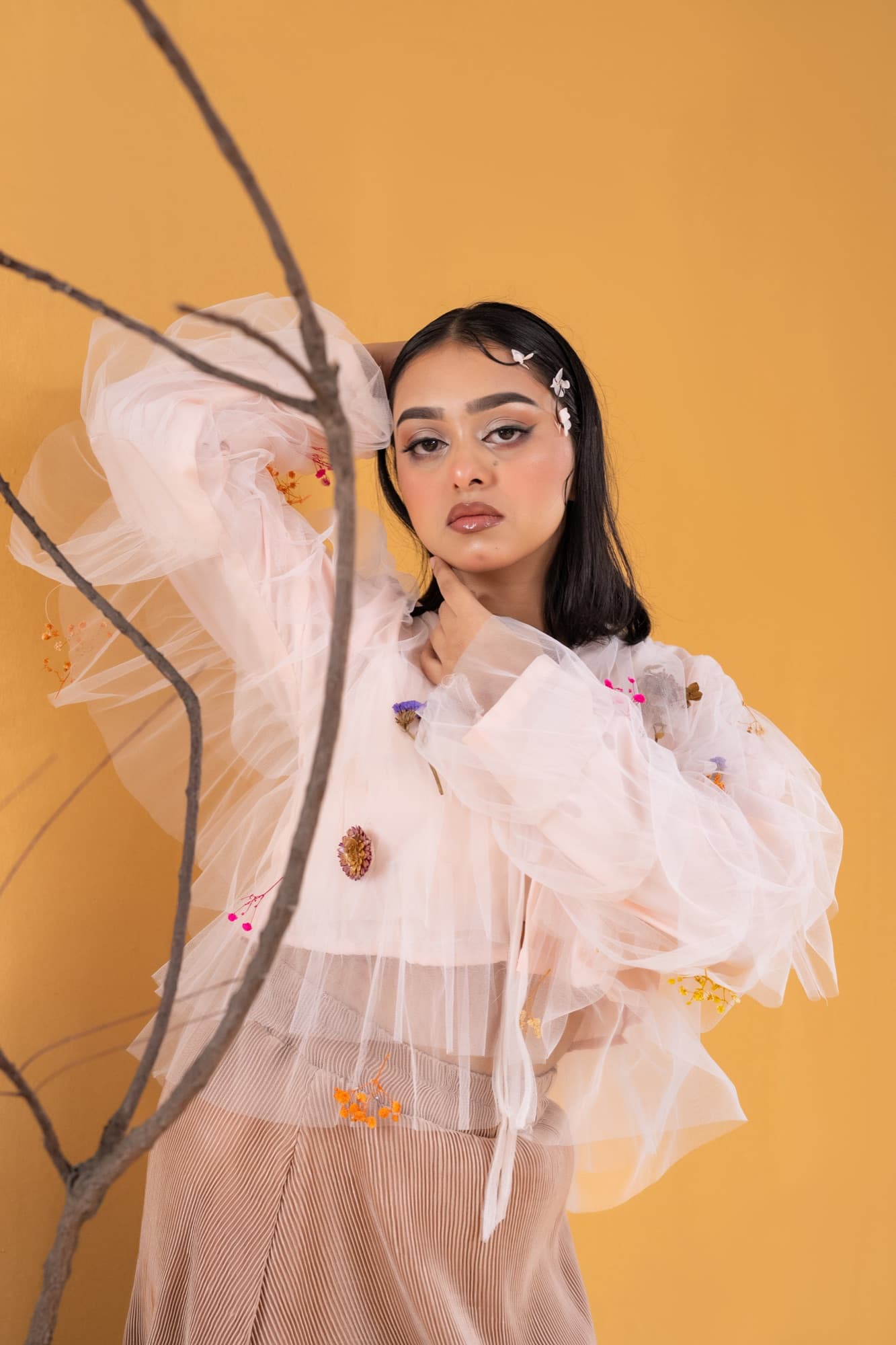 Petal Remains BUFT Graduation Couture Collection 2026 by Bangladeshi fashion designer Narin Juhi — layered organza in dusty rose, violet, cocoa and ivory with ruffles and dried-flower embroidery, photo 29 of 36