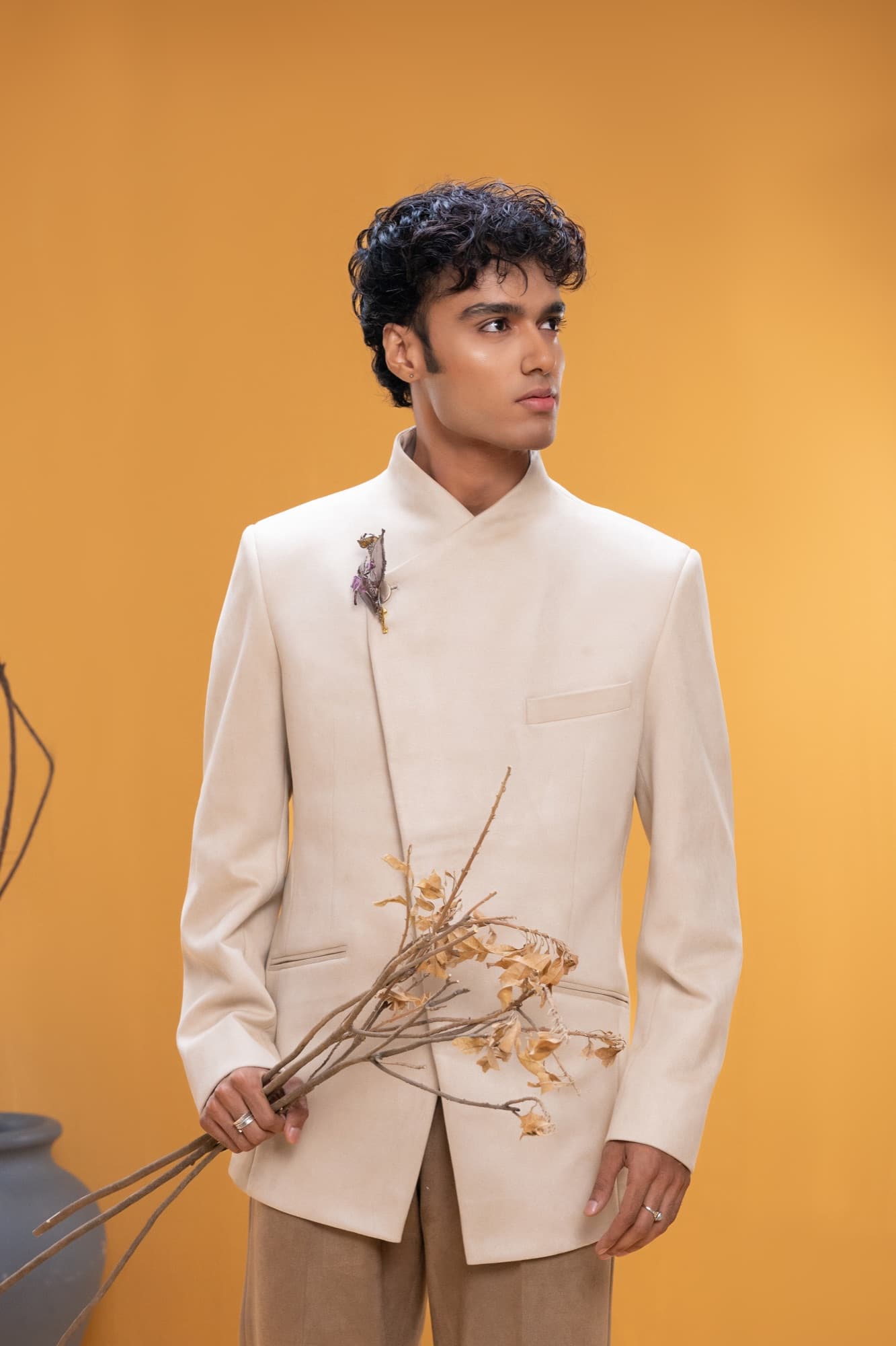 Petal Remains BUFT Graduation Couture Collection 2026 by Bangladeshi fashion designer Narin Juhi — layered organza in dusty rose, violet, cocoa and ivory with ruffles and dried-flower embroidery, photo 23 of 36