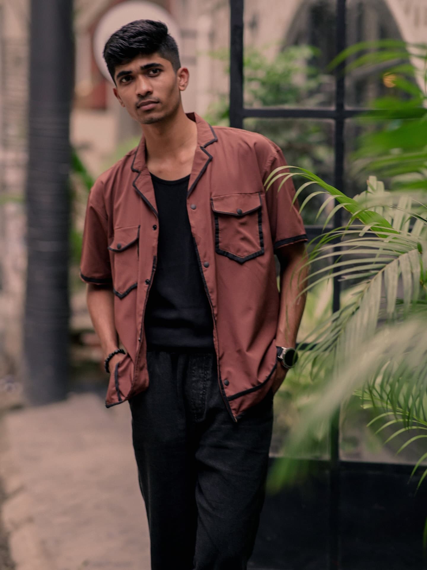 Rust camp-collar shirt with contrast pockets over a black tee — Wear Indo ready-to-wear by Bangladeshi fashion designer Narin Juhi